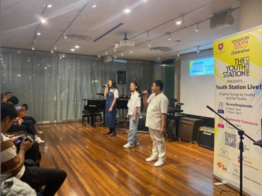 Students singing in a song writing competition